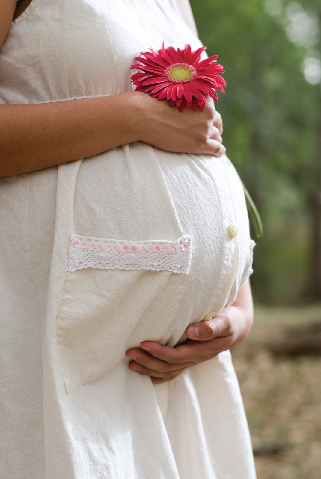 Pregnant Woman in White Dress