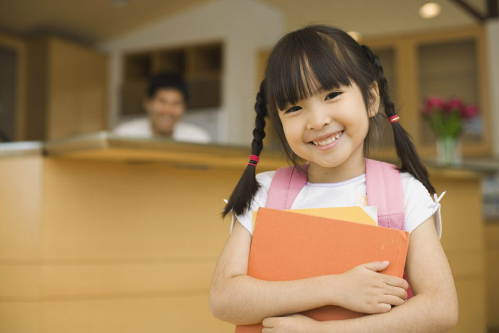 School girl holding binder