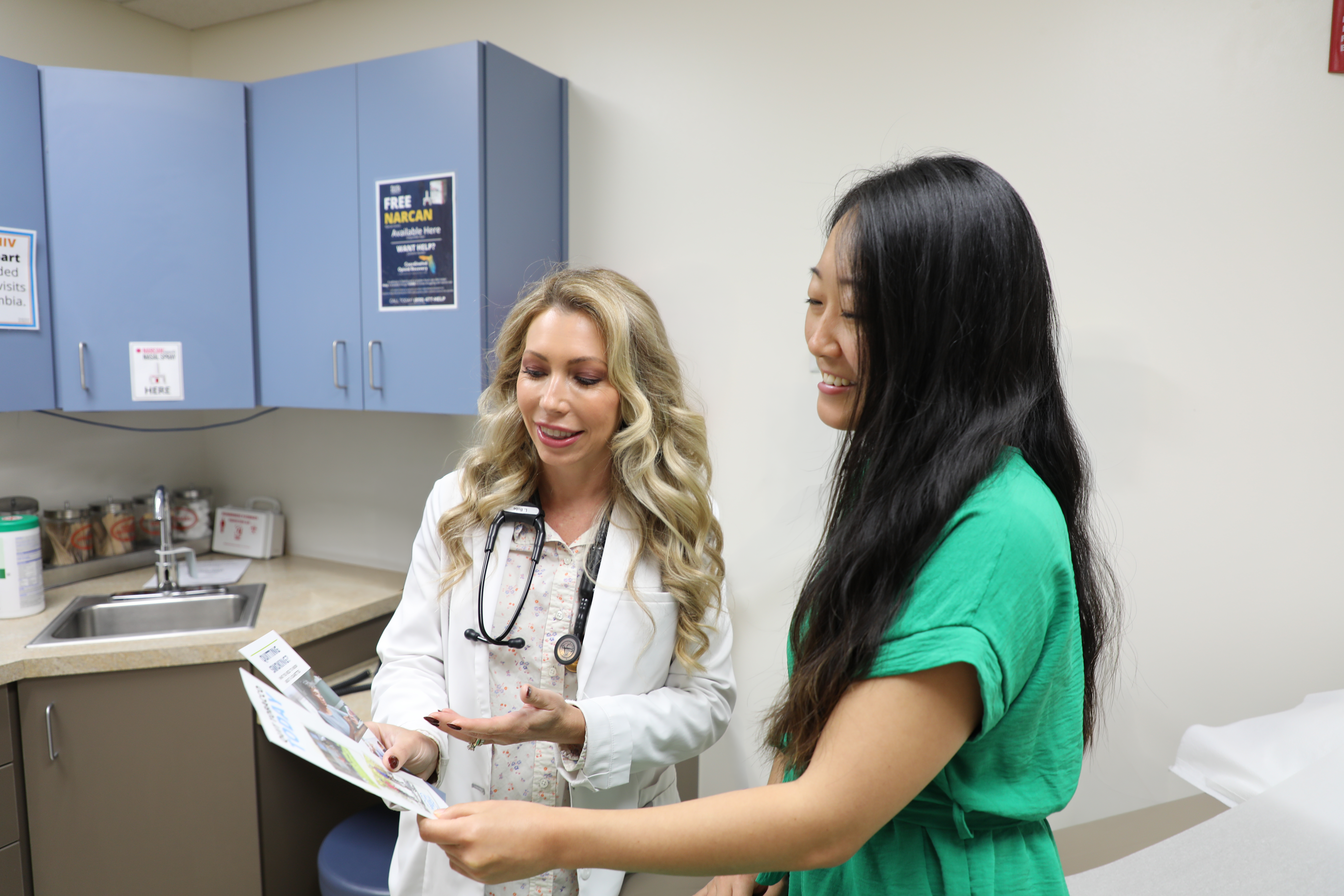 Health care professional speaking with patient